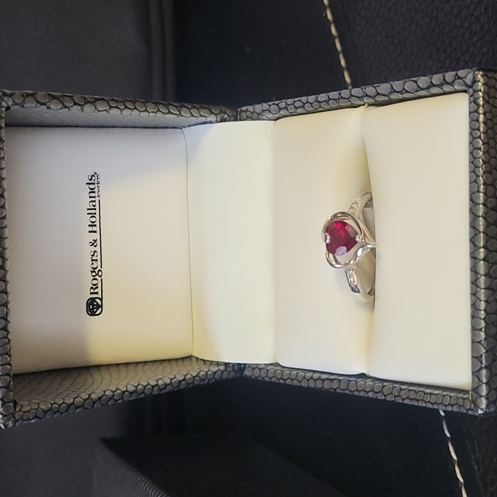 Red stone heart shaped band around stone Ring from Roger's & Hollands